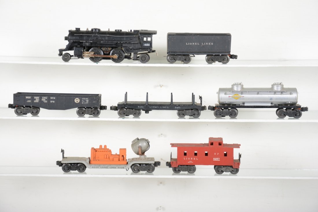 Lionel 1655 Steam Freight Set: Includes a 1655 steam loco; 1654W tender; 2452 PRR gondola; 2465 tank car; 3451 lumber car; 6520 searchlight; 6257 SP caboose. All show moderate playwear, C6-6+
