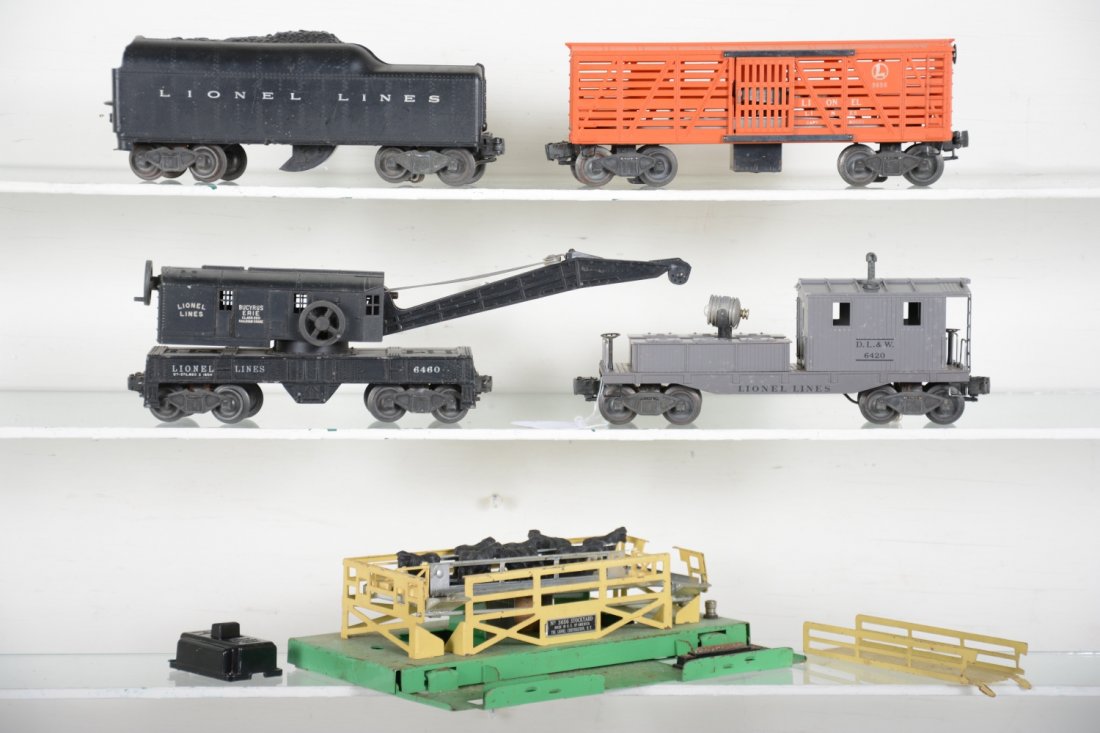Lionel Freight Group: Includes a nice 6420 searchlight work caboose, C8; 6460 crane, no hook, dirty; 3656 cattle car with pen, 90% complete; 2046W tender, shell cracked. Rest show moderate playwear, C6