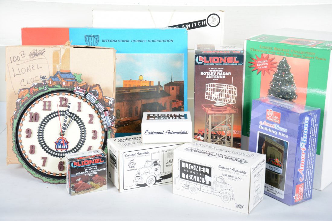 Train Accessory Lot: Includes an IHC O Scale 2-stall engine house kit; Lionel Blue Comet animated Christmas display; Lionel 12749 radar tower; 2283 cast bumpers; Lionel 100Th Anniv. Clock; O Gauge Theater with lighted mar