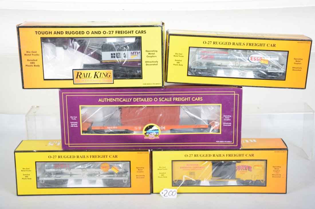 MTH Freight Cars: Includes 20-98354 B&LE TTX flat; 30-7928 MTHRRC crane; 33-7308 Esso tank; 33-7306 Shell tank; 33-7412 Curve Beer boxcar. All appear new in boxes, C10