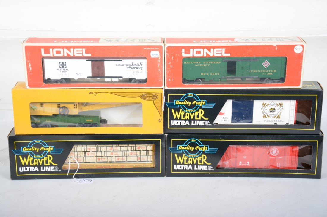 Lionel & Weaver Freight Cars: Includes Weaver 1313 Apache Powder TNT Boxcar; U2709 UP Bulkhead lumber car; 19992 Tamaqua PS-1 boxcar; Lionel 9332 Reading crane; 9869 SF reefer; 9863 REA reefer. All appear lightly run or mint in bo