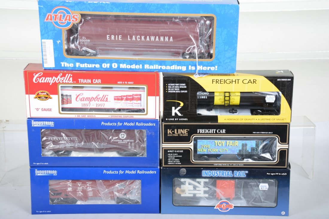 Modern Freight Cars: Includes an Atlas 6303-1 Erie Cylindrical tank; K-Line- 1998TF Toy Fair hopper; 675404 Campbell's pickle car; 21363 Reading tank; Industrial 36819 NH boxcar; IDM 4003 NYC hopper; 1002 PRR Boxcar. All 