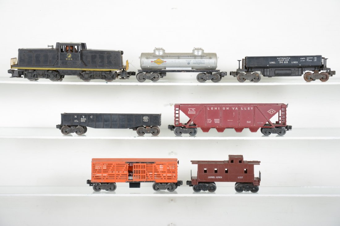 Lionel Freight Cars: Includes a 3562-75 barrel car, no accessories, rust on trucks; 6362-55 truck car with 2pc load; 6456 LV hopper; 2 6415 tank cars; 2 #6462 gondolas; 6468 B&O boxcar. All need a good cleaning, C5-6