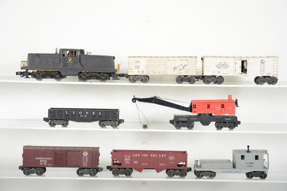 Lionel 628 Diesel Freight Set: Includes a 628 NP 44-ton diesel, large screw chip; 6014 Frisco boxcar; 6012 gondola; 3472 milk car, car only; 6454 PRR boxcar; 6456 LV hopper; 6560 crane cab on 6460 frame; 6419 work caboose, crack in