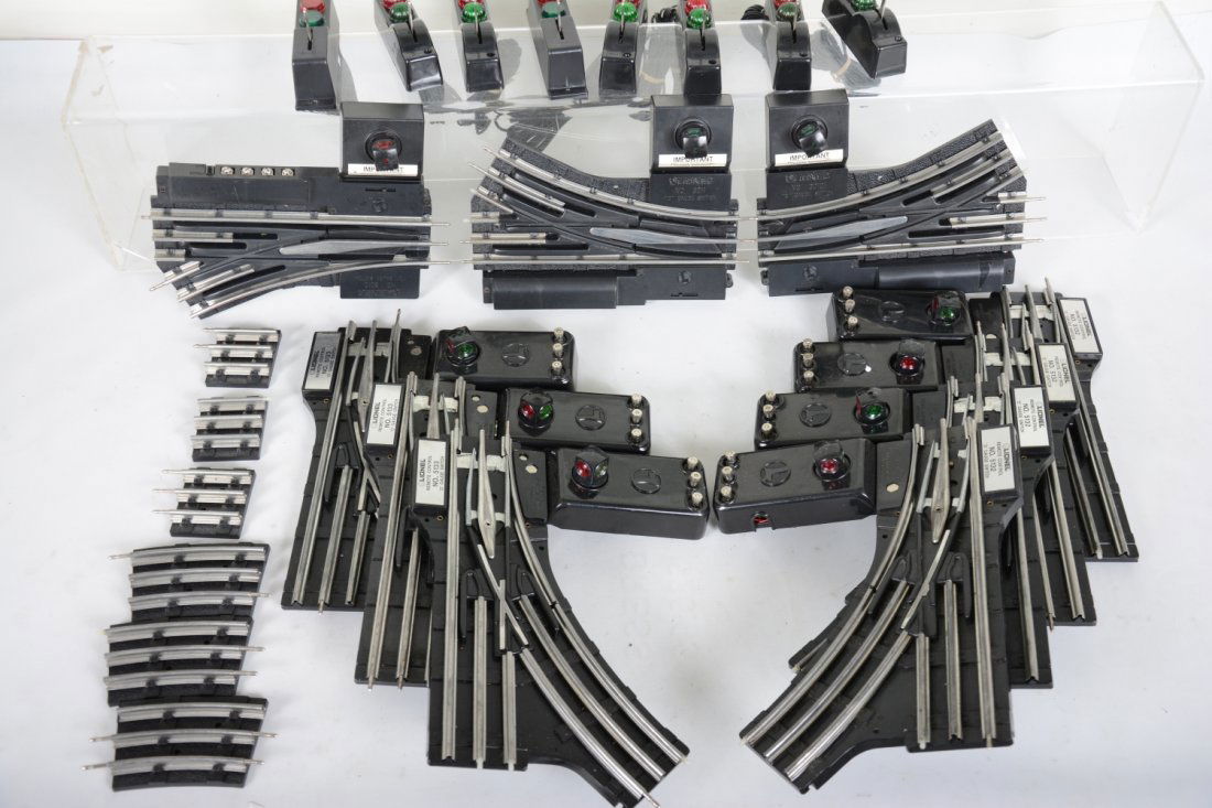Lionel Modern Switches: Includes 3 1/2 pair 5131/2 O gauge with controllers and caps; 1 1/2 pairs 3010/11 027 switches with 1 controller and some sectional track. All are clean and like new.