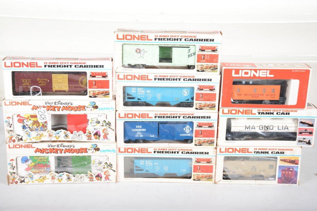 Lionel Freight Cars, 2 Mickey Mouse Cars: Includes 9661 Goofy Hi-Cube; 9662 Donald Duck Hi-Cube; 2 #9011 GH hoppers, 1 ob stained; 9401 GN boxcar, ob taped; 9169 MR caboose; 9726 Erie boxcar; 9279 Magnolia tank; 6408 UP hopper; 9466 Wanamaker