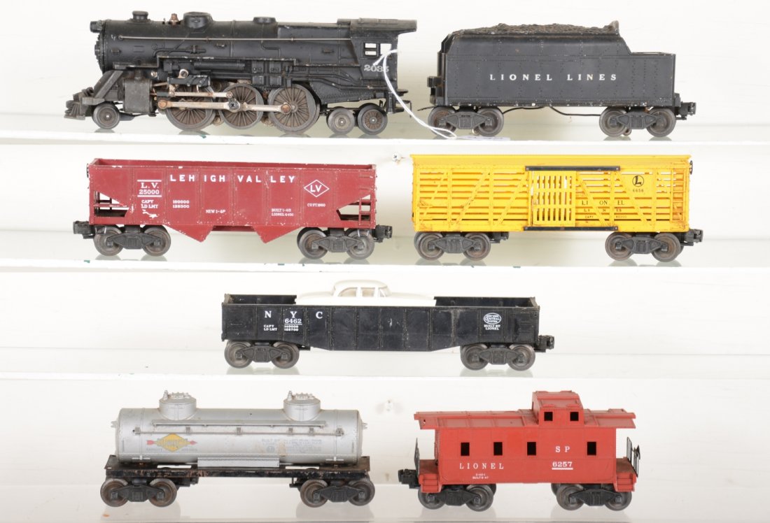 Lionel 2035 Steam Freight Set: Includes a 2035 2-6-4 steam loco; 6466W whistling tender; 6656 stock k car; 6456 hopper, C4; 6465 Sunoco tank car; 6462 gondola with a repro vehicle; 6257 caboose. Rest show light to moderate playwear