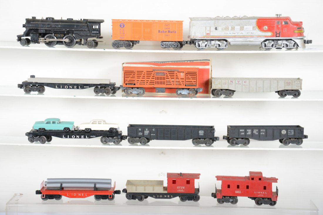 Lionel Postwar Lot: Includes a 2333 SF F3 Dummy diesel. Horn opening has been plugged, mildewed, C3; 1654 loco; 2454 gondola; 6462 gondola; 6119-100 work caboose; empty 6262 wheel car; 6257 caboose; 6121 pipe flat; 6034