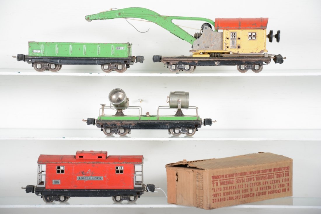 Lionel 2810, 2820, 2812, 2817, Plus: Includes work train cars 2812 gondola; 2820 searchlight; 2810 crane, missing hook, but gears function; 2817 caboose, all show moderate to heavy playwear, C4-5, Plus an empty 260T tender box.