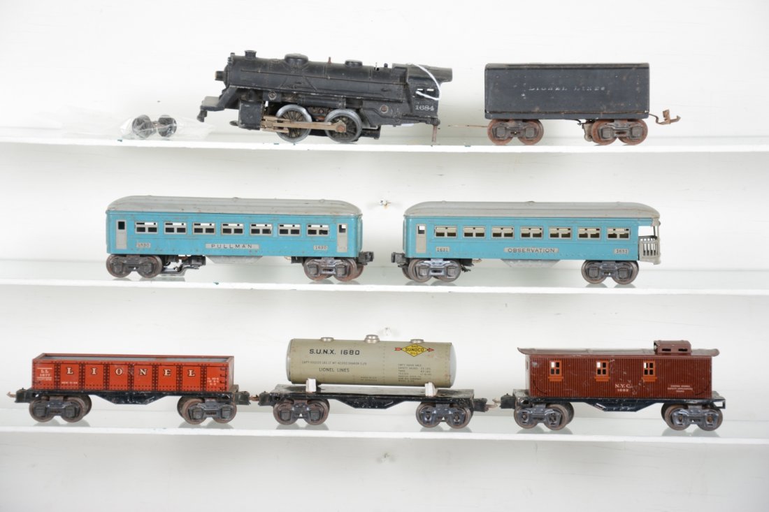 Lionel Pre War Group: Includes a 1684 steam loco, pony trucks loose, trailing truck needs wheels; 1689W tender; 1680X tank car; 1677X gondola; 1682X caboose; 1630 Pullman, postwar couplers added, but box couplers still int
