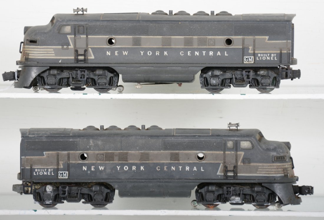 Lionel 2333 NYC F3 AA Diesels: Dual motor early F3s. They have matching cabs, missing port hole lenses 1 number board. There is a small battery corrosion spot near cover pivot rivet and they desperately need a cleaning. They show m