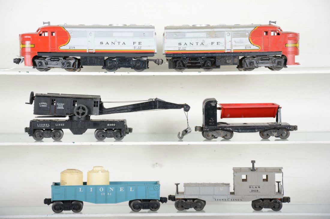 Lionel 218 Diesel Freight Set: Includes a 218 SF Alco AA Diesels, 1 cab intact, other broken cowl; 6112 gondola with canisters, 1 as-is; 3559 coal dump; 6460 crane, later boom; 6419 work caboose. All could benefit from a good clean