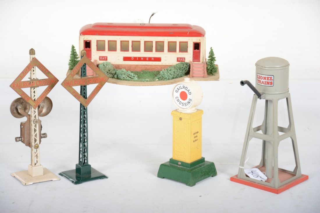 Restored Lionel Accessories: Includes a 442 diner; 93 water tank; 69 warning sign & 85 crossing gate, light fatigue to upright. Otherwise nicely restored.