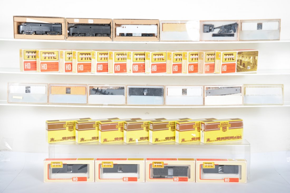 TMI HO Undecorated Loco & Cars Lot: Includes 2 FA-1 powered diesels, 1 is C7; 1 FB-1 dummy A unit, plus 30+ assorted Freight cars with hoppers, stock cars, transit/supply cabooses; flat cars, reefers boxcars & more. Rest appear new in b