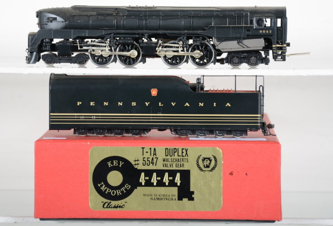Key Brass PRR T-1a Duplex 4-4-4-4 #5547: HO Gauge. Like New, test or very light signs of operation, may have light dust from display, light signs of handling, may have some tarnishing to finish. Original box, C9