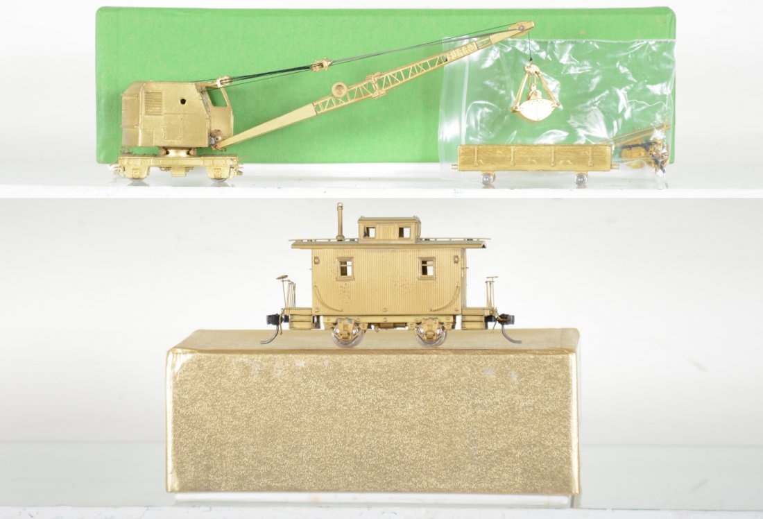 Brass HO Crane & Caboose: Includes an Overland Burro Crane with tender; Oriental low cupola bobber caboose. HO Gauge. Like New to Mint, unrun, may have minor dust from display, near perfect paint, may have some tarnishing to f