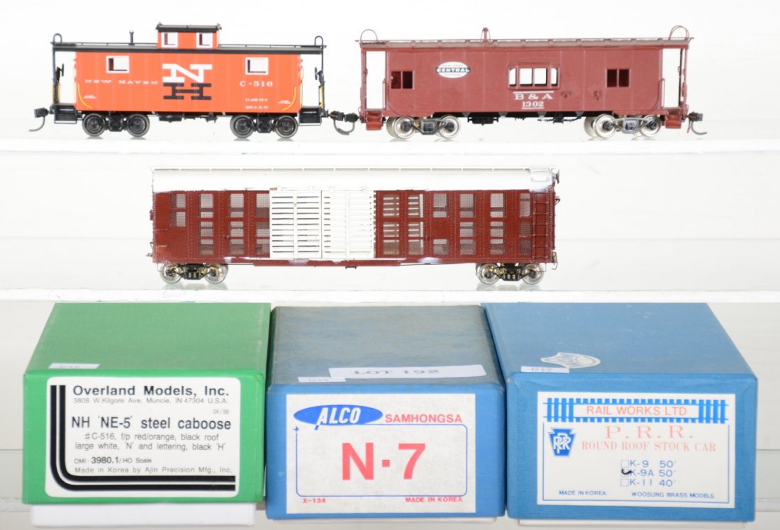 3 Brass HO Freight Cars: Includes an Alco NYC N-7 wood side bay window caboose; Rail works 50ft round roof stock car; Overland/Ajin NH NE-5 caboose Factory painted C-516. HO Gauge. Like New to Mint, unrun, may have minor dust