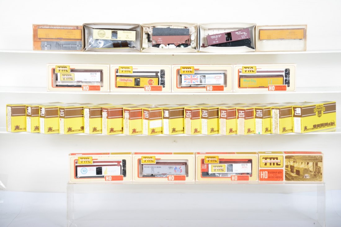 28+ TMI HO Limited Edition Freight Cars: Assorted styles including 1982 San Diego Convention wood boxcar; North Prairie Electric wood Boxcar; 1972 NMRA reefer; Hammant & Morgan Ltd boxcar; MACS 1972 convention, HobbyKing boxcar and others, a