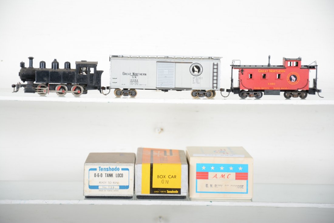 Brass HO Great Northern Freight Set: Includes a Tenshodo 0-6-0 tank loco; Tenshodo GN boxcar; AMC GN 254 caboose lettered X-590. All Factory painted with boxes, loco dusty, HO Gauge. Like New, test or very light signs of operation, may h
