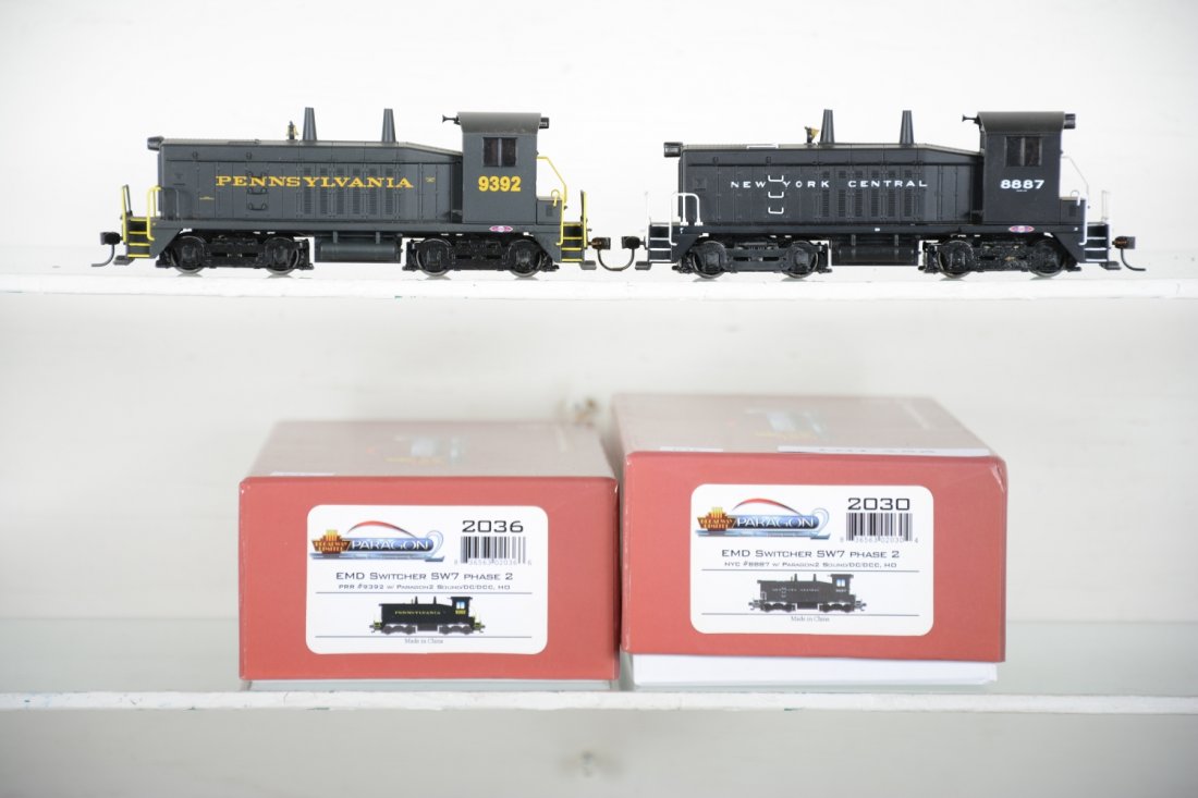 2 Broadway Ltd Paragon SW7 Phase II Diesels: Includes 2036 PRR #9392 & 2030 NYC #8887. Both equipped with DC/DCC & Sounds. 2036 is mint C10, 2030 shows light runtime with C9 body, both have box.