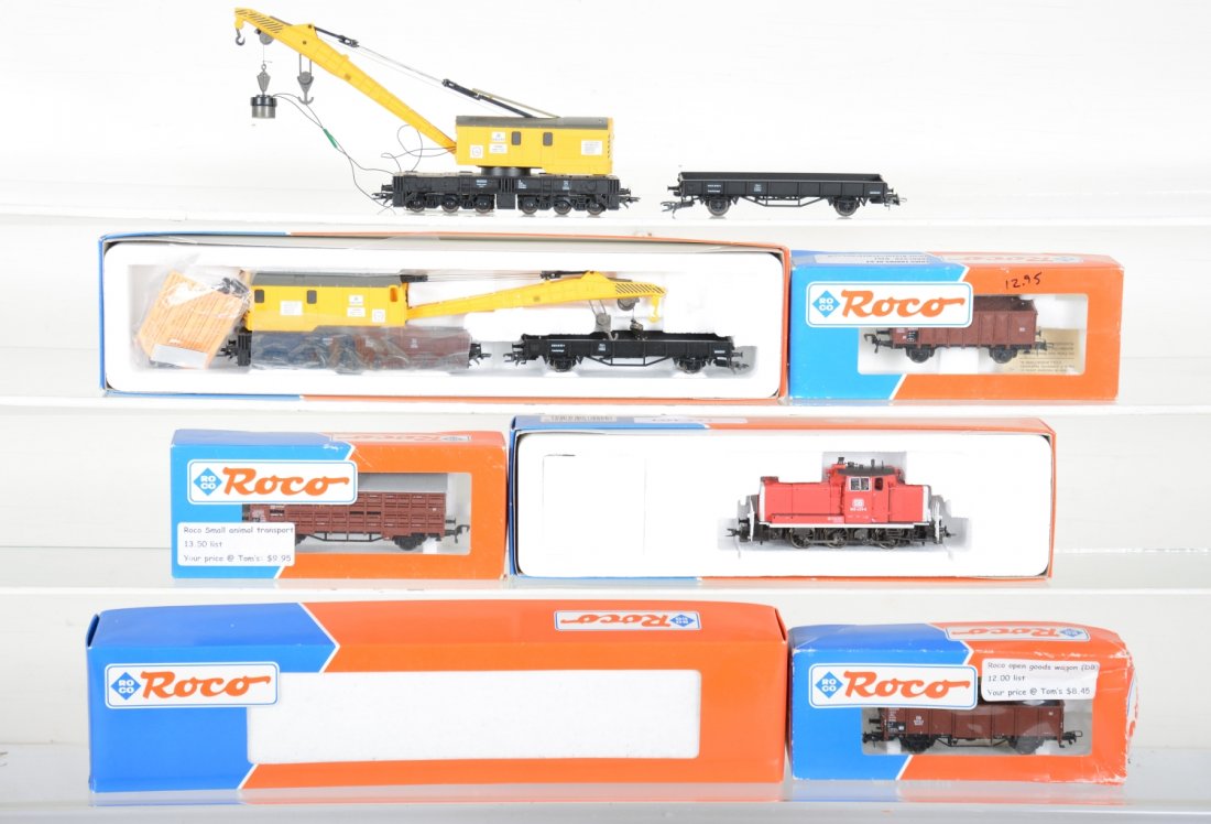 Boxed ROCO HO Lot: Includes a 63420 2-rail Digital diesel, broken coupler; 2 #46900 operating electric 3-rail wrecking cranes with tenders, 1 is new in box, C10, other has broken coupler; 2 #46043 open car; 46035 stock