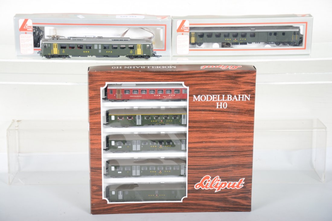 Lilliput Lima HO Swiss Passenger Set: Includes a Lima 208203LP power car & coach fitted with Jabee 36" wheel sets; Lilliput 877 5-car SBB FFS passenger set. All show light runtime with C9 bodies and boxes.
