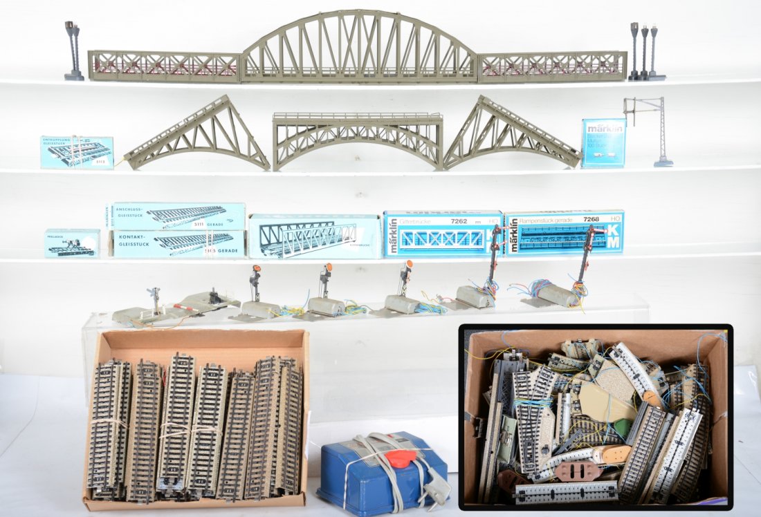 Large Group of Marklin M-Track & Accessories: Includes 5 signals, several bridges in both tin & plastic and a large number of assorted remote switches and track & transformer, enough to make a sizable and intricate layout. All moderately used. Lo