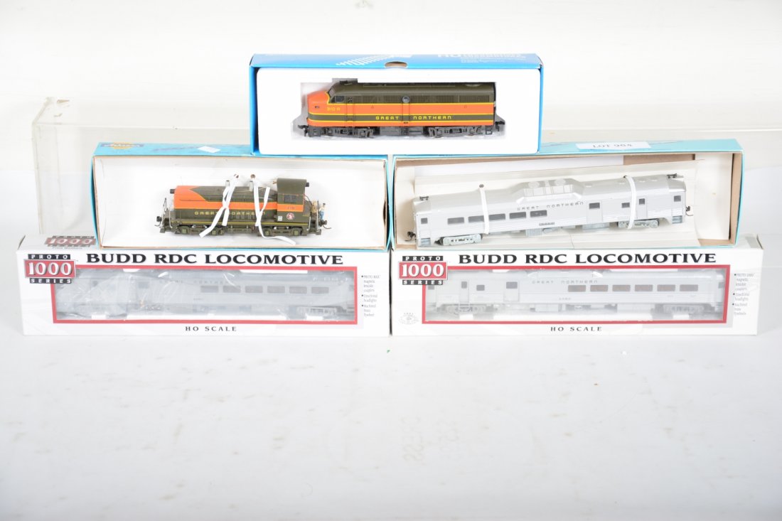 Boxed HO Great Northern Powered Units: Includes 2 Life-Like/Walthers Proto 1000 GN Budd powered Combine cars; Athearn GN Powdered Budd combine, drive bands missing; Athearn SW-1500 diesel; Fratesch1002 F7 A diesel. All show some show light