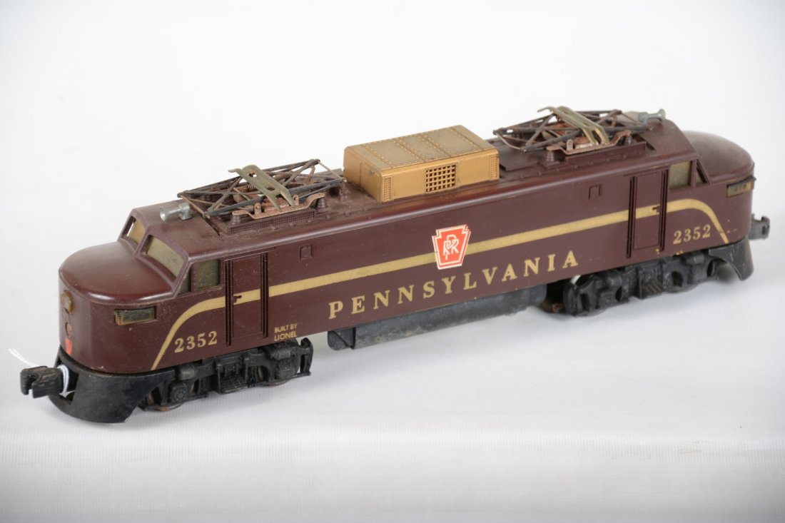 Lionel 2352 PRR EP-5 Electric: Tougher loco on yellow mold. It does have a crack on one nose and light battery damage to frame. It shows moderate playwear, C5ish