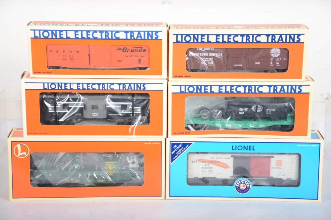 Lionel Rolling Stock: Includes 15001 Seaboard waffle boxcar; 16927 NYC flat with gondola; 1500 DRGW waffle boxcar; 19726 NYC bay window caboose; 26961 fire ladder car; 39257 dealer WP boxcar. All are factory mint, C10