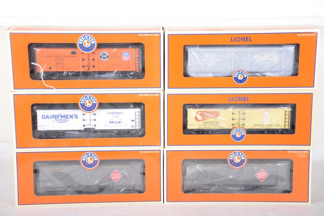 Lionel Freight Cars: Includes 17341 Dairyman's milk car; 52333 Harmony milk car; 52576 Crystal dairy milk car; 17334 REA milk car; 17336 PFE reefer. All are new in boxes, C10