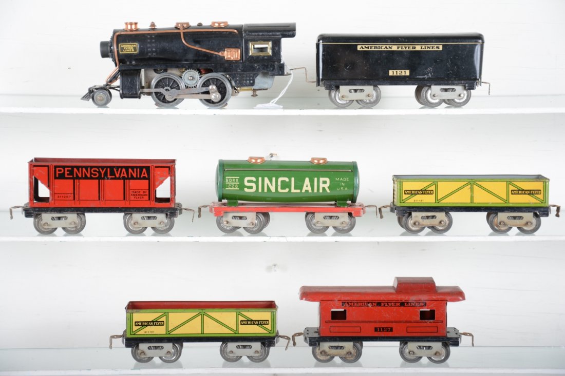 American Flyer Steam Freight Set: Circa 1937. Includes a 1231 2-4-0 steam loco with whistle; 1122 tender; 2 #1131 sand cars; 1126 hopper; 1228 Sinclair tank car; 1127 caboose. All show light to moderate playwear, C6-6+