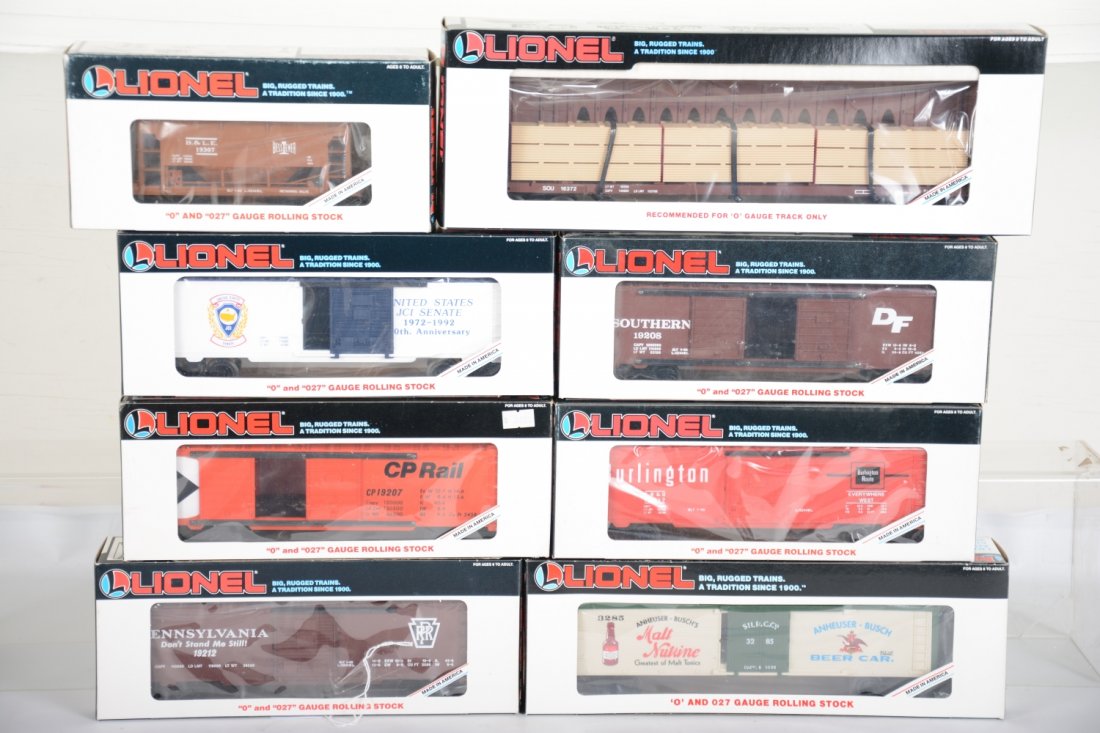 8 Lionel Freight Cars: Includes 19212 PRR boxcar; 19307 B&LE ore car; 19207 CP Rail boxcar; 19964 US Senate boxcar; 19217 Burlington boxcar; 19208 Southern Boxcar; 16805 Annheuser-Bush reefer; 16372 Southern flat with wood 