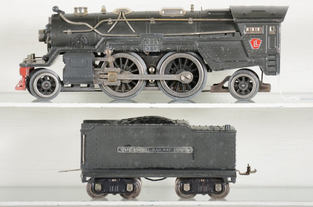 Clean Nickel Lionel 385E Steam Loco: Standard Gauge. Circa 1936. Clean with straight frame, replaced steam chests; 385W whistling tender with minor wave to castings. It shows moderate playwear, C5+-6