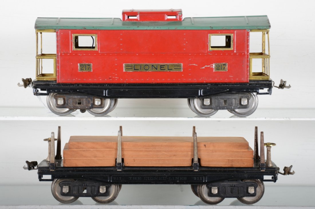 Clean Lionel 211 & 217 Freight Cars: Standard gauge. Includes a nice 211 lumber car, C8; 217 mid period caboose, showing light to moderate playwear, C7
