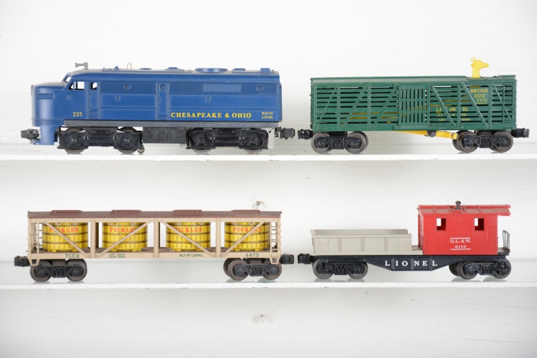 Lionel 225 Diesel Freight Set: Includes a 225 C&O Alco A diesel, intact; 6475 pickle car, light oxidation spots on frame; scarce 3376 green giraffe car, no accessories; 6119-100 work caboose. All could benefit from a light cleaning