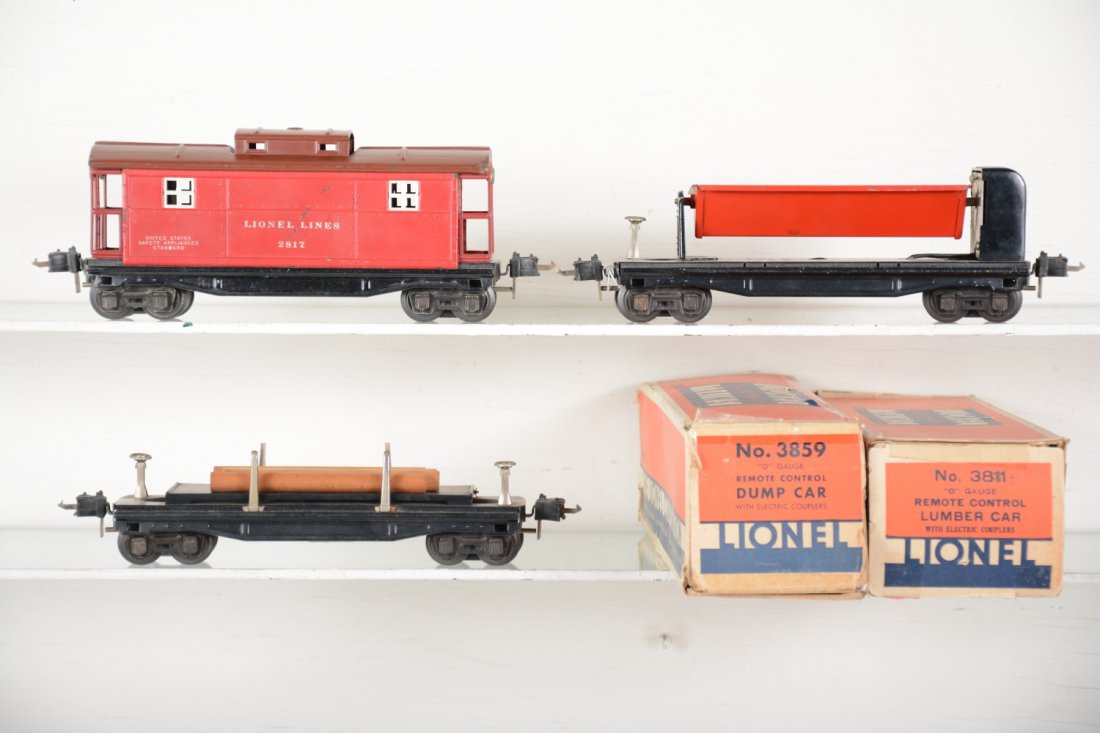 Late Lionel 3651, 3659 & 2817 Freight Cars: Includes a 3651 log dump; 3659 coal dump; 2817 caboose, all late high box couplers with deep dish frames. Includes 2 boxes for operating cars, some tape, all show light playwear, C7+-8