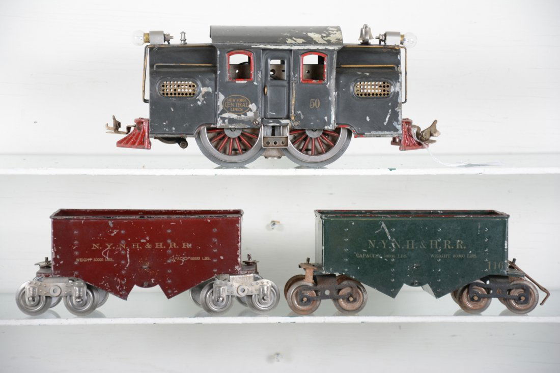 Lionel 50 Train Set: Standard Gauge. Includes a 50 center cab electric, unusual in dark gray with nice lettering, 20% flaking, C4+-5; 2 #116 hoppers, 1 is Lionel MFG. Cars show moderate playwear, C6