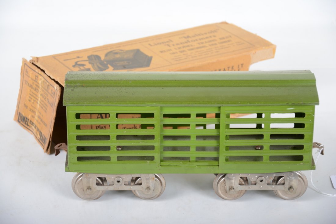 Boxed Lionel 13 Stock Car: Standard gauge. Clean & shiny, showing light handling, appears unrun. It has some oxidation spots under paint on roof, but not too offensive. This version was boxed with its trucks stored inside. Roug