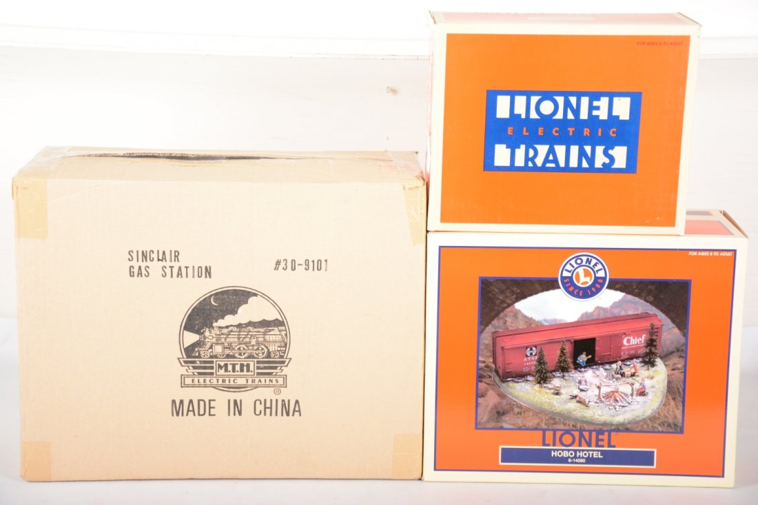 Lionel & MTH Accessories: Includes Lionel 14080 Hobo hotel; 12862 oil drum loader; MTH 30-9101 Sinclair gas station. All are new in boxes, C10