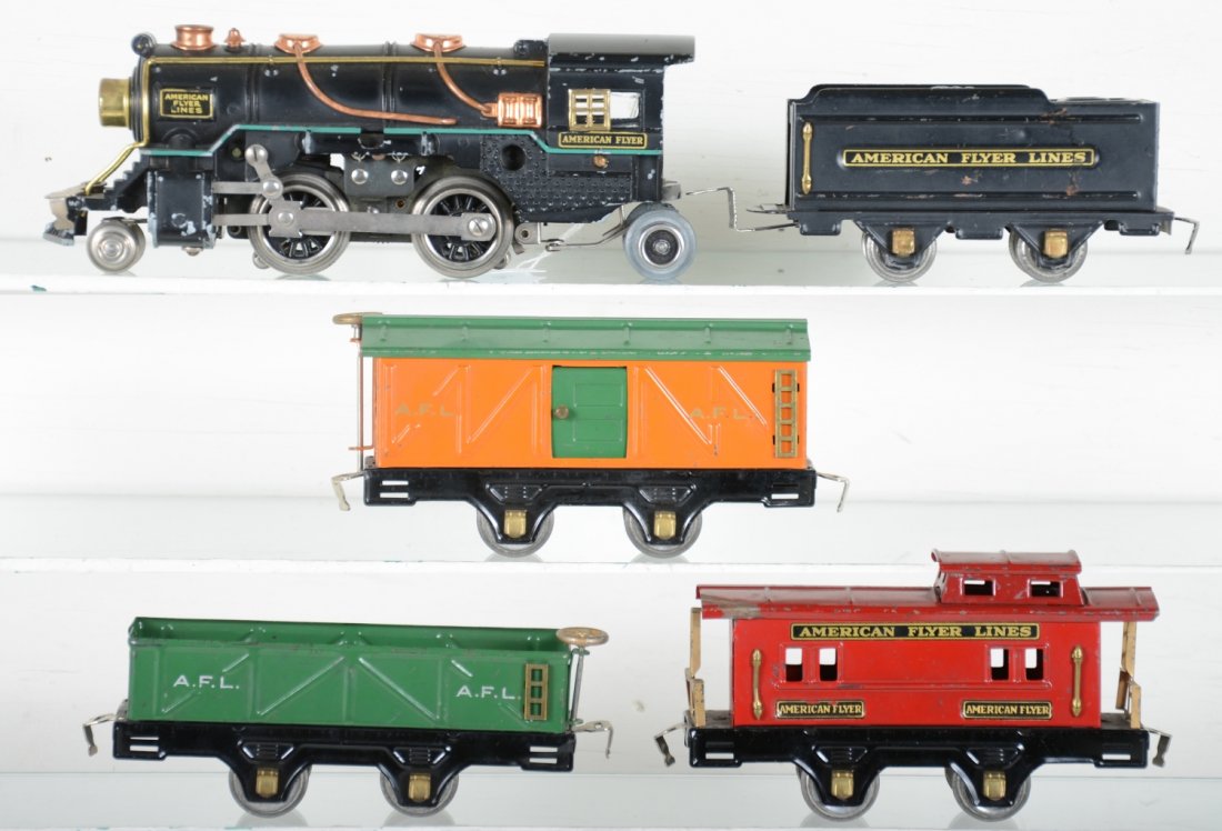 American Flyer Steam Freight Set: Circa 1932. Includes a 3307 steam loco, drive wheels fatigued; AFL tender; 3013 sand car; 3012 boxcar; 3014 caboose, all are clean and only show moderate over-all playwear, otherwise C6+