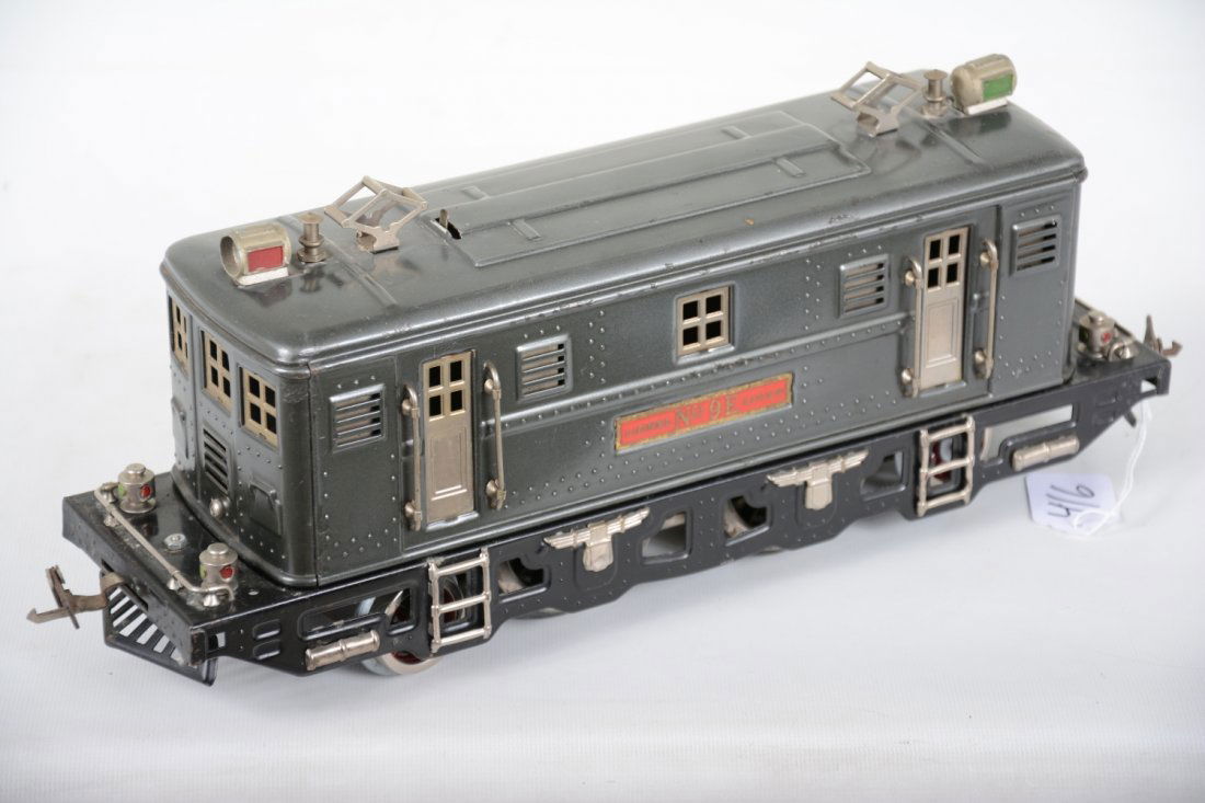 Clean Lionel 9E Boxcab Electric: Standard gauge. Shiny 2-4-2 electric. It has replaced wheels and wiring, appears ready to run, showing light to moderate playwear, C7