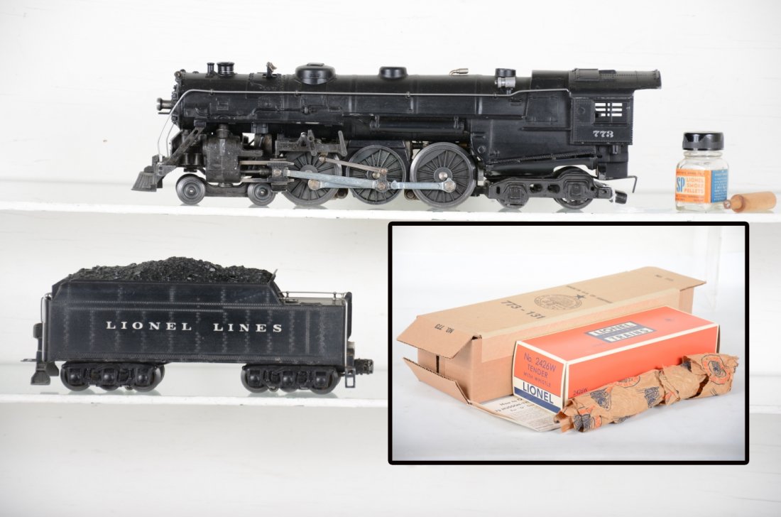 Nice 1950 Lionel 773 Hudson Steam Loco: Clean with nice lettering; matching 2426W cast whistle tender. It has its instructions, tamper and SP pellets and comes with a repro boxes. It shows light to moderate playwear, C7