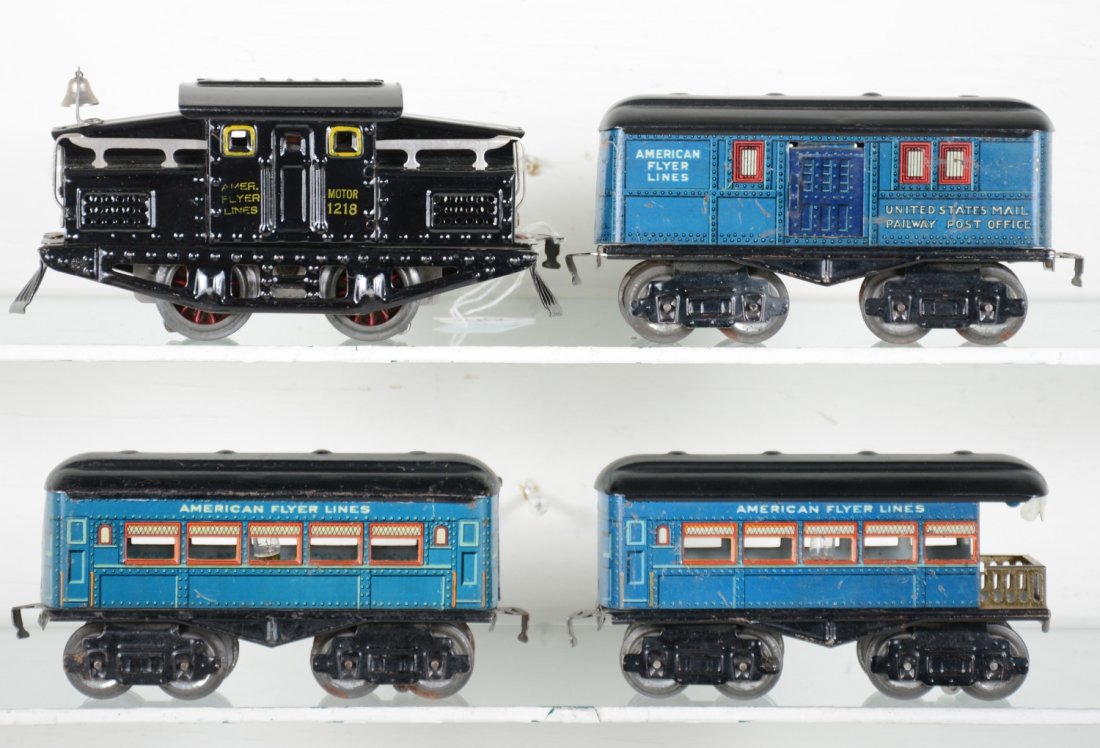 American Flyer Passenger Set: Circa 1925. Includes a 1218 center cab electric with strong lettering, beautiful, clean & shiny, C8; 1205 style baggage, 1206 style coach & observation. Sides are clean with 2 restored roofs, otherwis