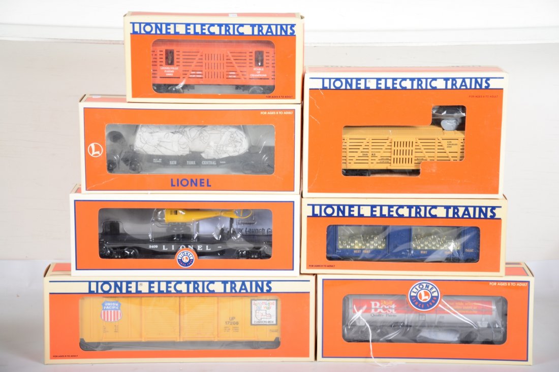 Lionel Rolling Stock: Includes 16683 operating elephant car; 19406 West Point Mint car; 29313 3409 helicopter flat; 16954 flat with scraper; 17208 UP standard O boxcar; 26145 Do It Best tank car; 16682 horse car. All are n