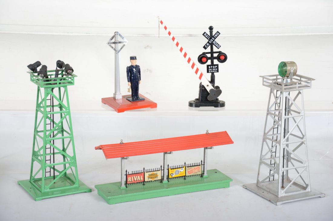 Lionel Accessories: Includes a 156 station platform; 395 floodlight tower; 494 beacon; 262 highway crossing; 1045 flagman. All could benefit from a light cleaning and show light playwear, C7+-8