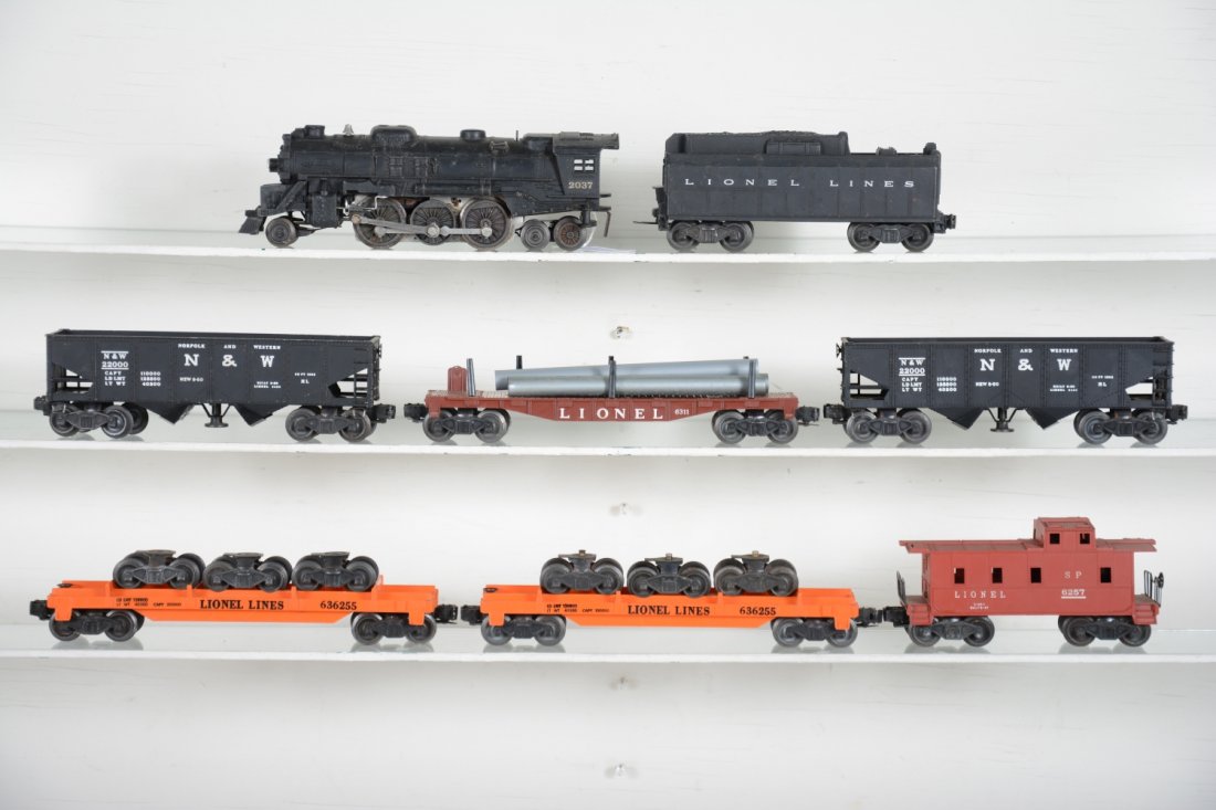 Lionel 2037 Steam Freight Set: Includes a 2037 loco; 6026T tender; 2 #3456 operating hoppers; 2 #6362 truck cars; 6311 flat with repro pipes; 6257 caboose. All show light to moderate playwear, C7