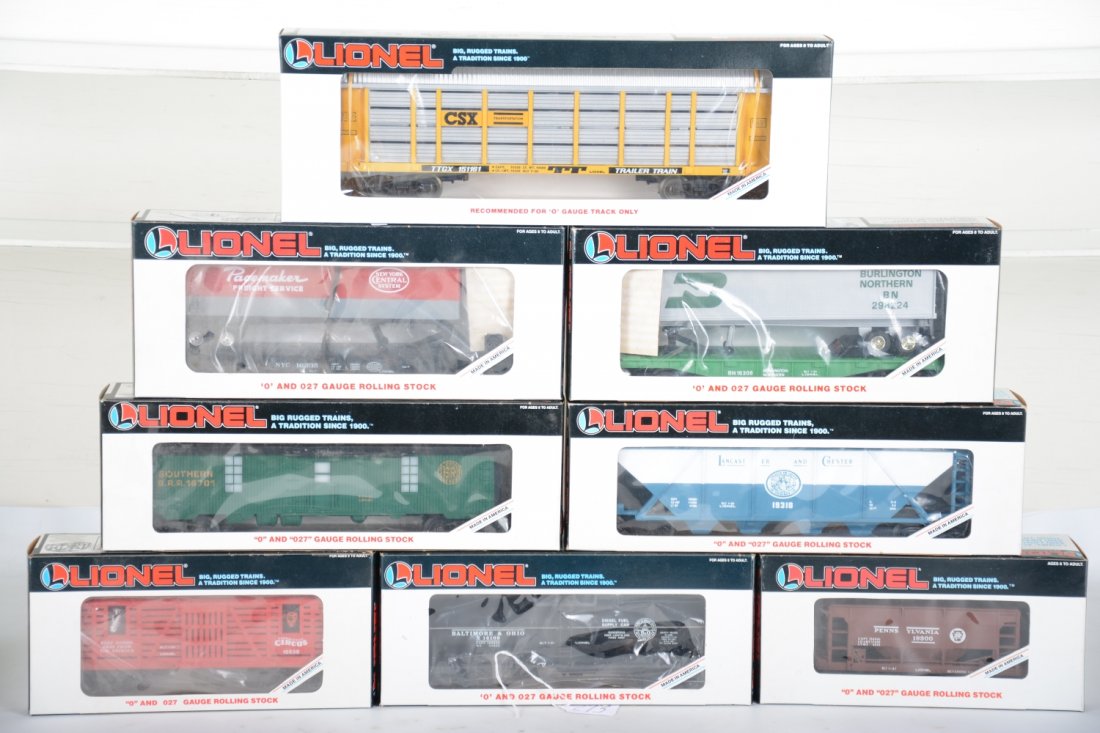 Lionel Freight Cars: Includes 16308 BN trailer flat; 17890 auto carrier; 16701 Southern tool car; 19310 L&C hopper; 16335 NYC trailer flat; 16638 Circus car; 16109 B&O tank car; 19300 PRR ore car. All are new in boxes, C1