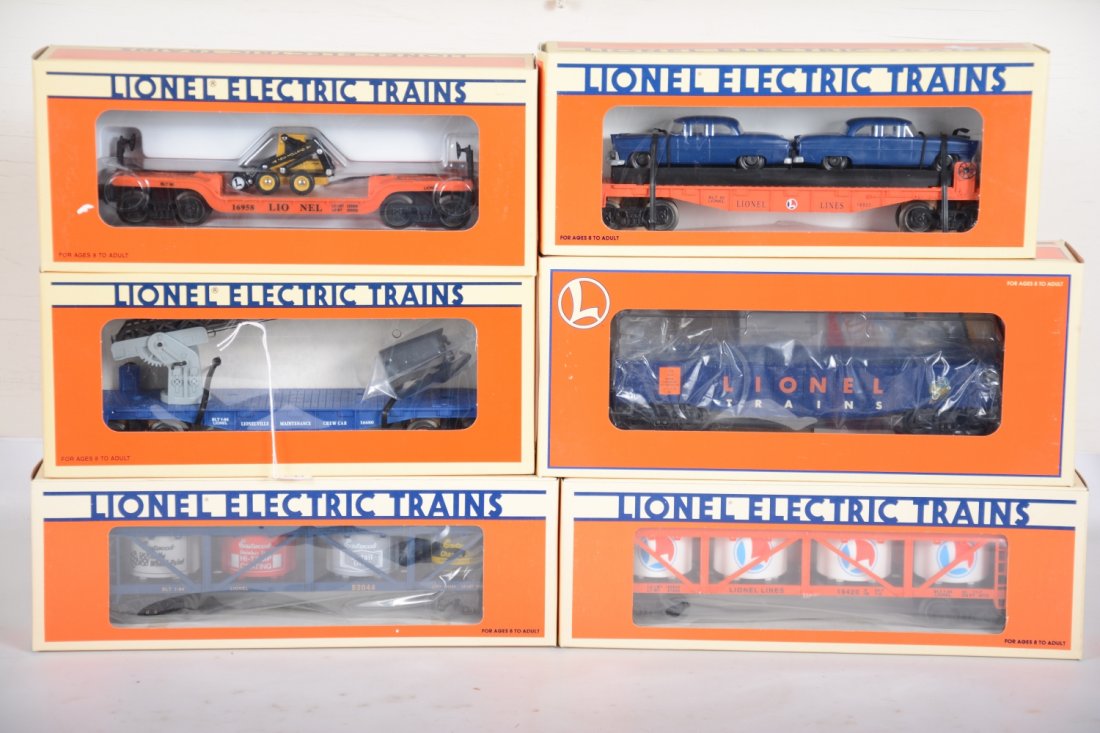 Lionel Series Freight Cars: Includes 16680 cherry picker; 17412 gondola; 16933 flat with autos; 52044 Eastwood vat car; 19420 vat car; 16958 flat with Holland loader. All are new in boxes, C10