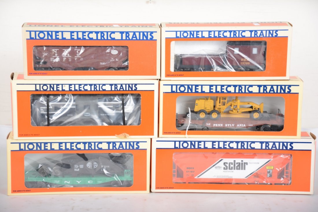 Lionel Freight Cars, 2 Operating: Includes 19709 PRR smoking work caboose; 9240 NYC operating hopper; 17107 Sinclair hopper; 19726 NYC bay window caboose; 16927 NYC flat with gondola; 16934 PRR flat with grader. All are new in boxes, 